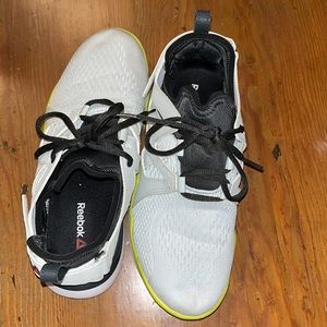 Reeboks all white with some yellow and a little black